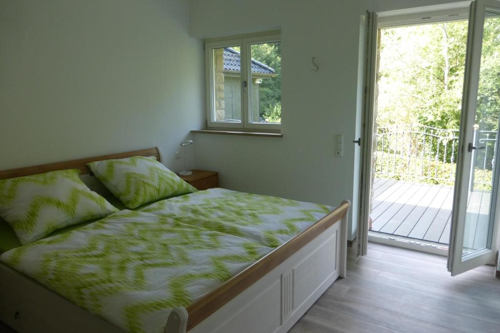 Postel nebo postele na pokoji v ubytování Ferienwohnung am Grölisbach