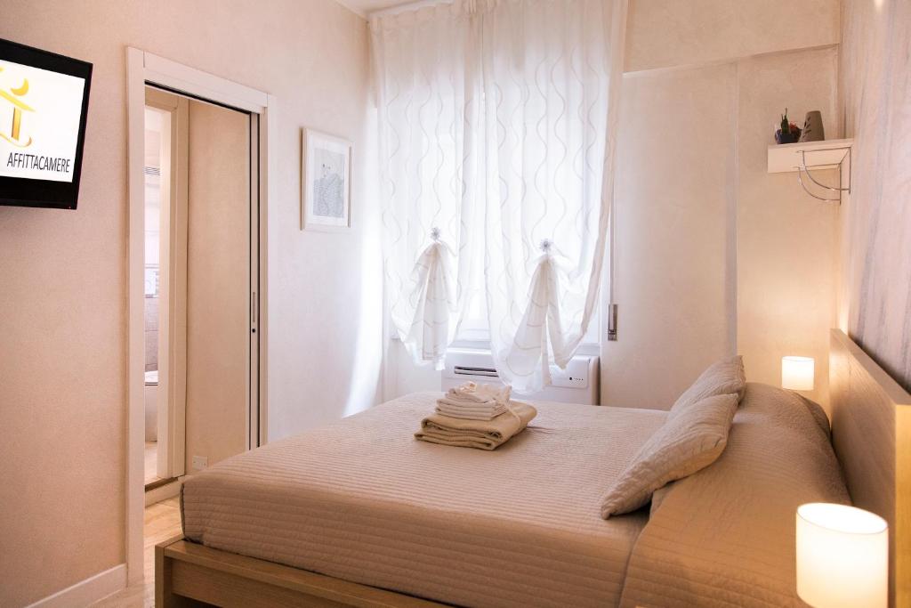 A bed or beds in a room at Gold House