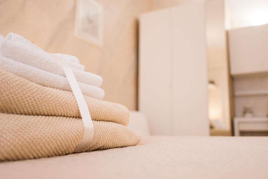 A bed or beds in a room at Gold House