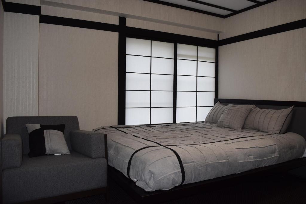 Postel nebo postele na pokoji v ubytování Nozawa Onsen BASECAMP