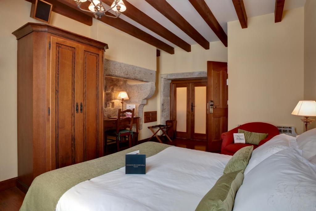 A bed or beds in a room at Airas Nunes by Pousadas de Compostela