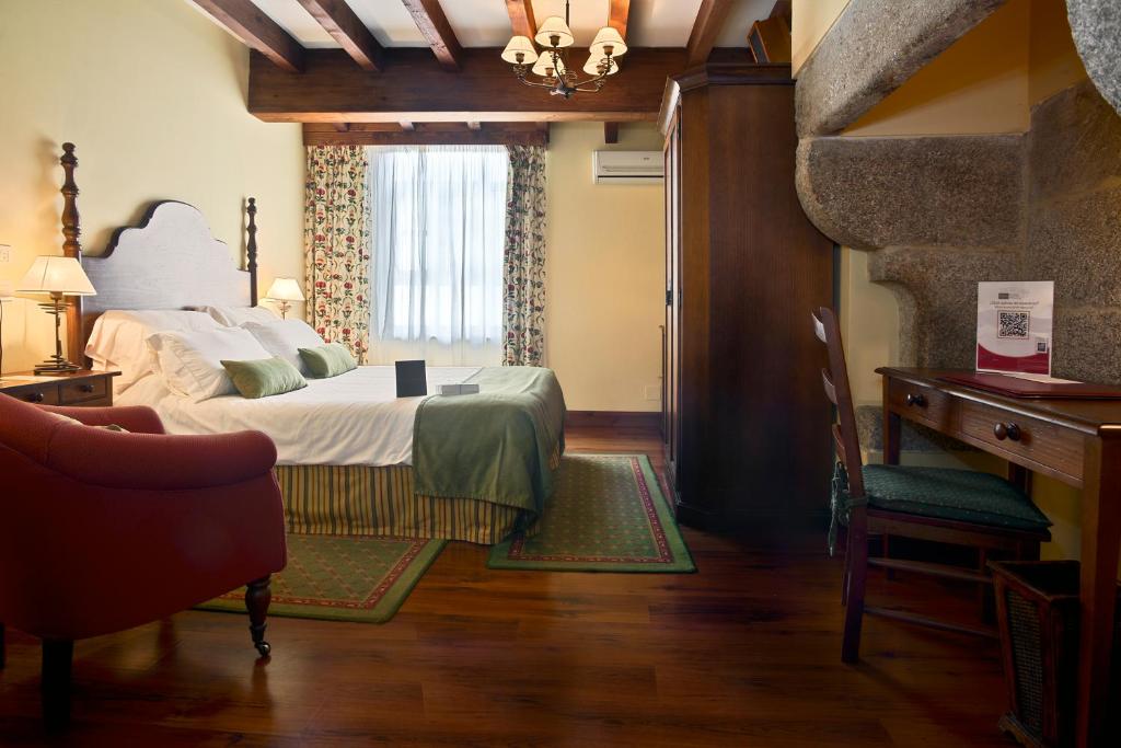 A bed or beds in a room at Airas Nunes by Pousadas de Compostela