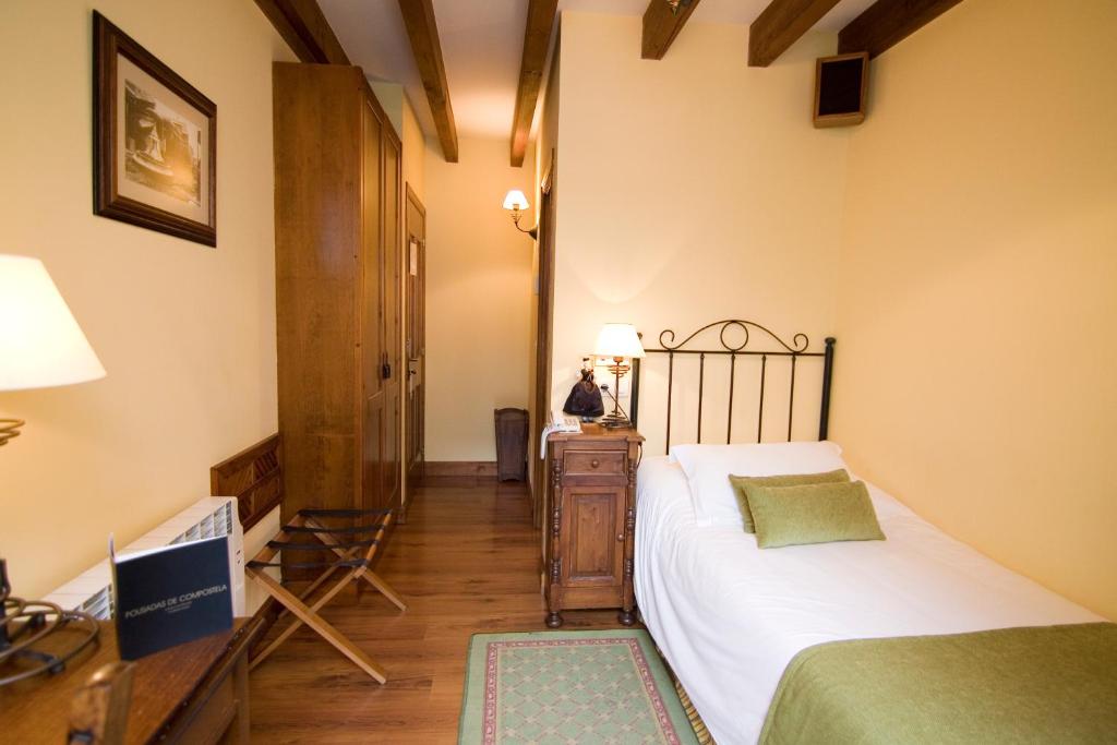 A bed or beds in a room at Airas Nunes by Pousadas de Compostela