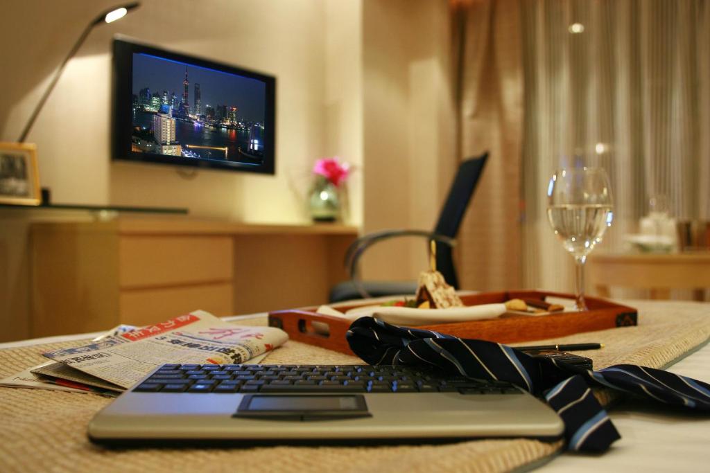 TV a/nebo společenská místnost v ubytování Jin Jiang Tower
