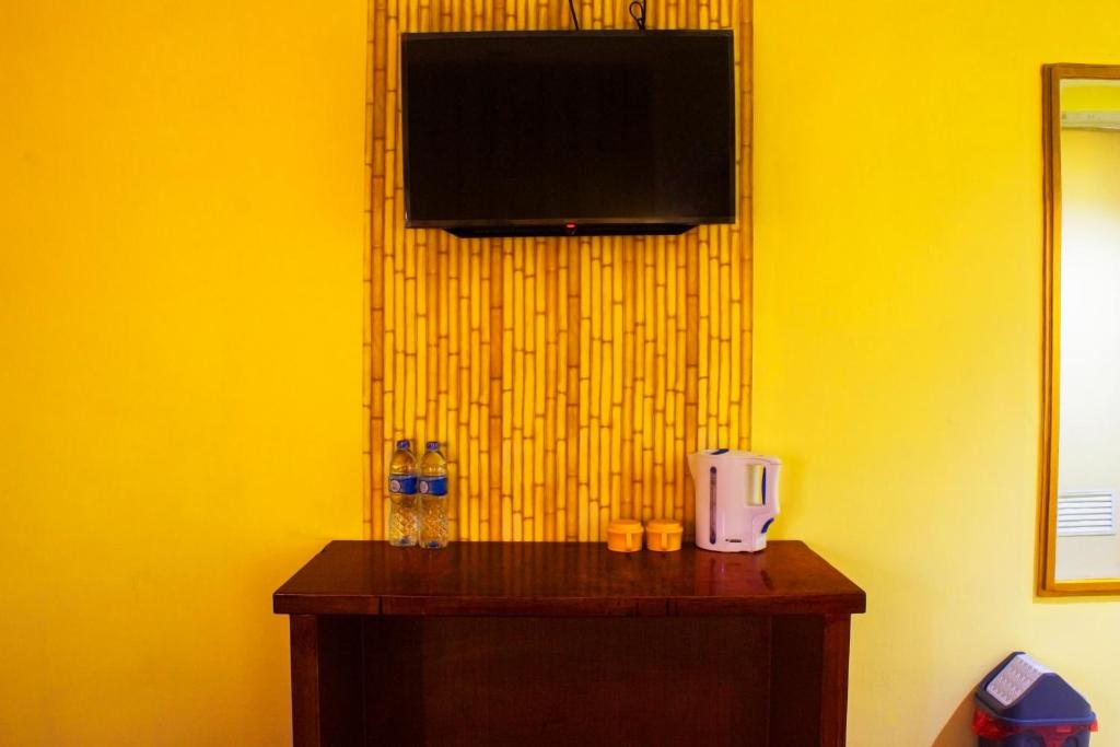 TV a/nebo společenská místnost v ubytování New Priok Indah Syariah Hotel