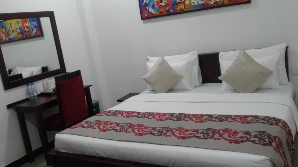 Postel nebo postele na pokoji v ubytování Colombo Residency