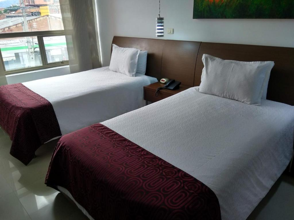 Postel nebo postele na pokoji v ubytování Hotel Merlott 70