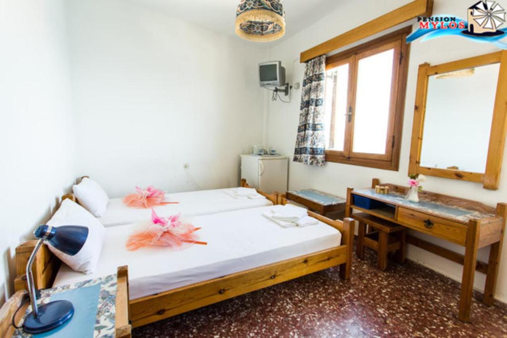 Postel nebo postele na pokoji v ubytování Pension Mylos