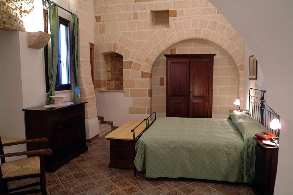 Postel nebo postele na pokoji v ubytování Masseria Bosco & Masseria Strazzati