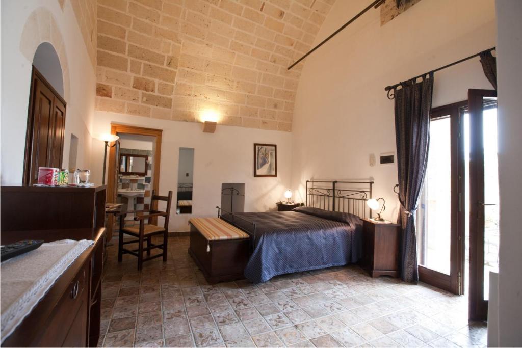 Postel nebo postele na pokoji v ubytování Masseria Bosco & Masseria Strazzati