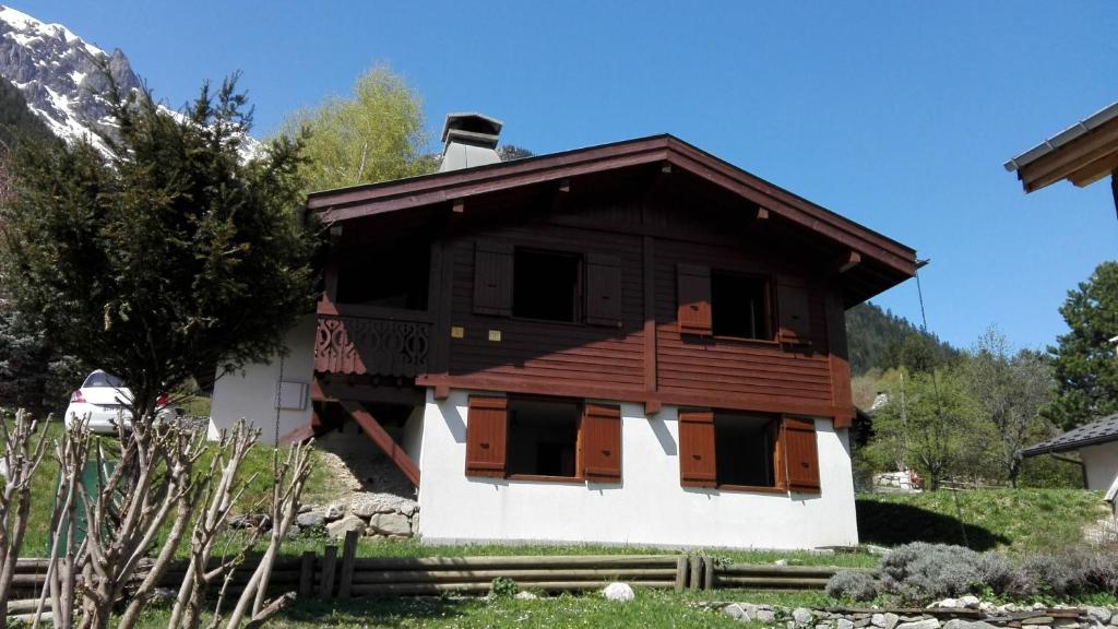 a small wooden house with windows and a roof at Chalet Erminea in Chamonix
