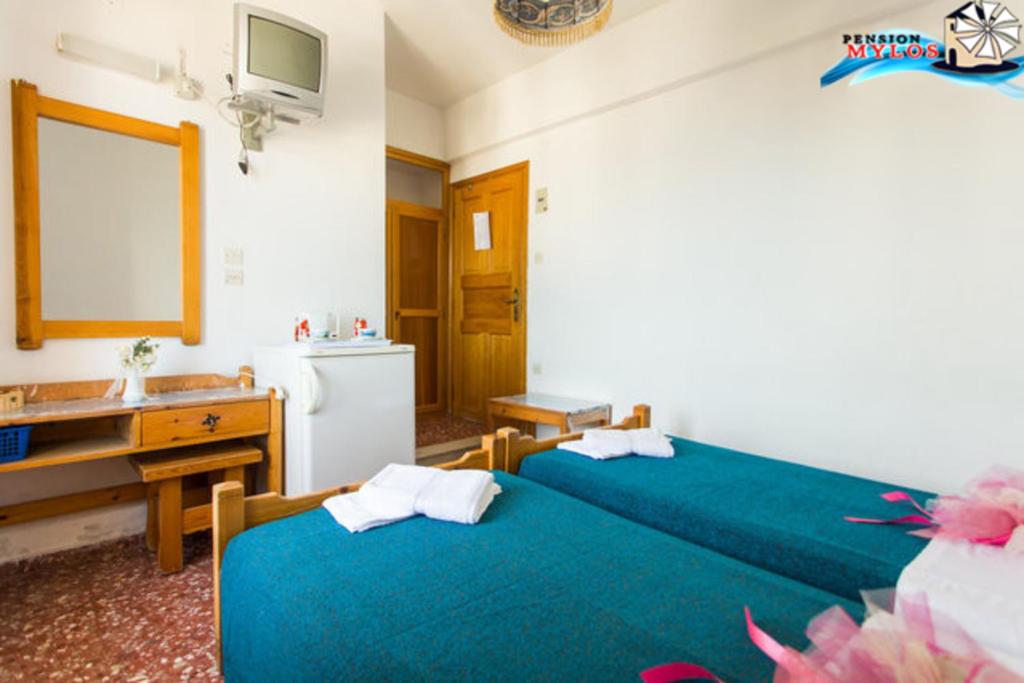 Postel nebo postele na pokoji v ubytování Pension Mylos