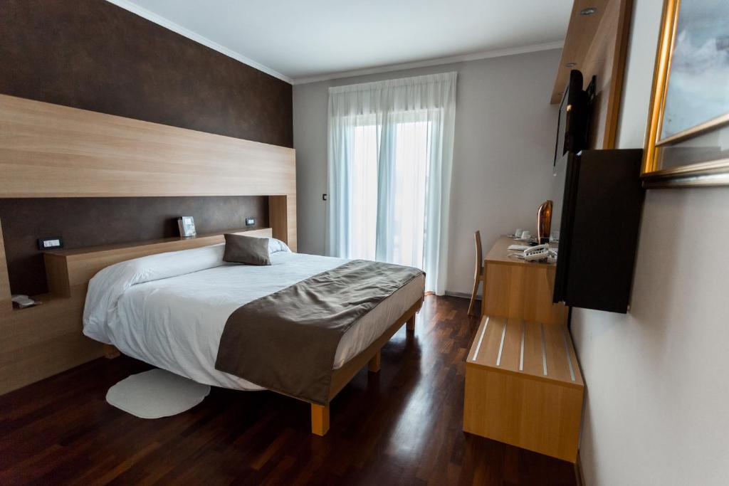 Postel nebo postele na pokoji v ubytování Halanus Hotel And Resort