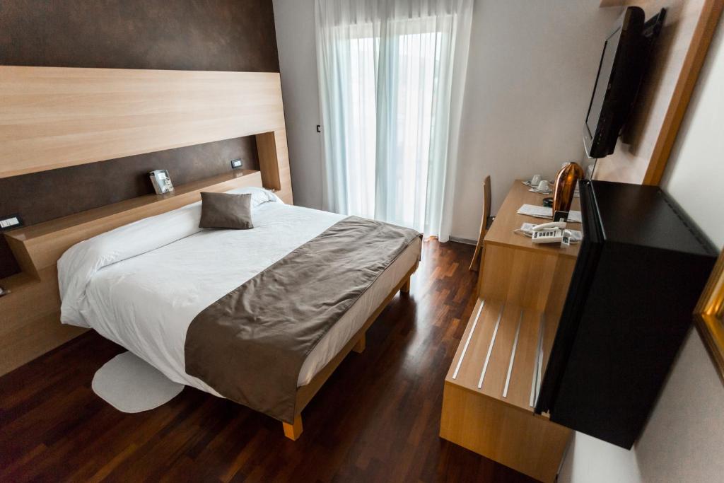 Postel nebo postele na pokoji v ubytování Halanus Hotel And Resort