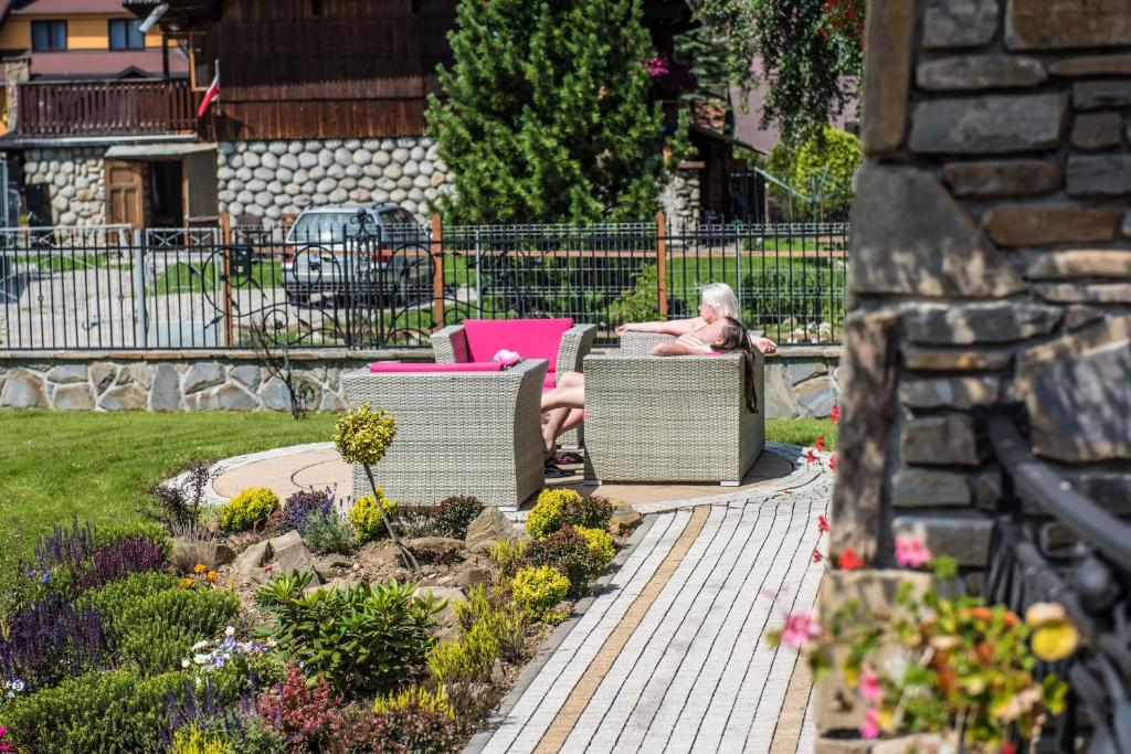 Vonkajšia záhrada v ubytovaní Helan Family & SPA