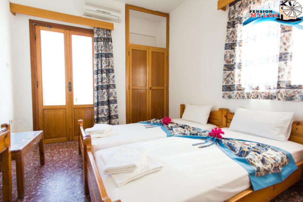 Postel nebo postele na pokoji v ubytování Pension Mylos