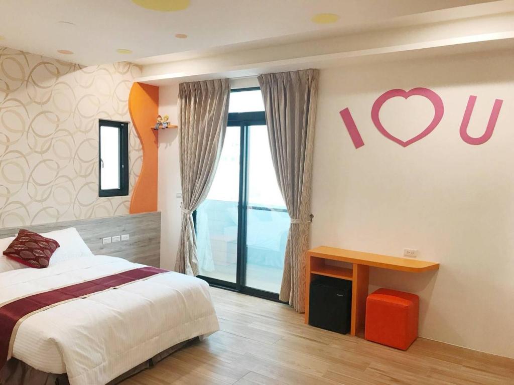 Postel nebo postele na pokoji v ubytování Purple Shell Homestay II