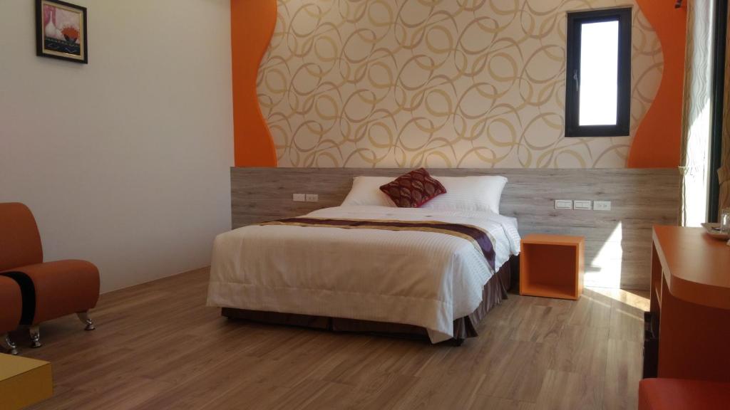 Postel nebo postele na pokoji v ubytování Purple Shell Homestay II