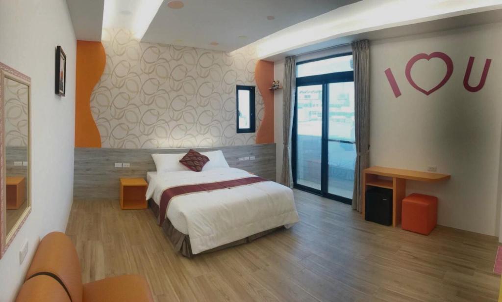 Postel nebo postele na pokoji v ubytování Purple Shell Homestay II