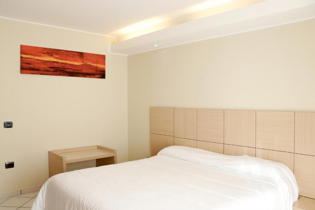 Postel nebo postele na pokoji v ubytování Hotel Ancora
