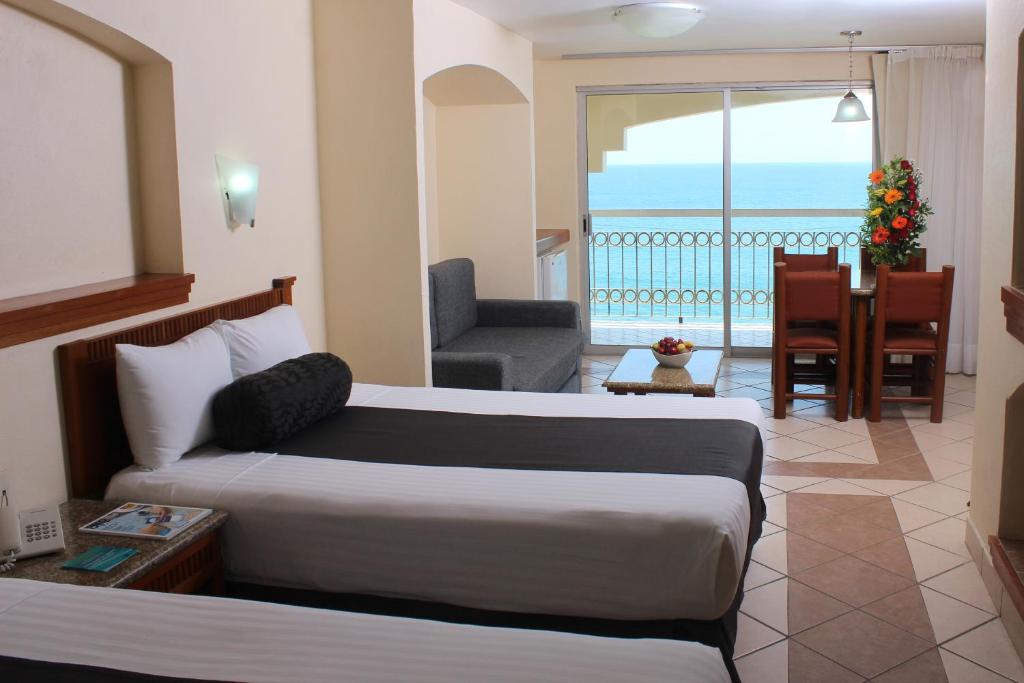 Cama o camas de una habitación en Don Pelayo Pacific Beach