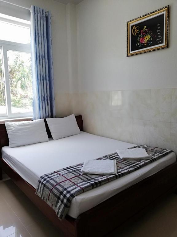 Postel nebo postele na pokoji v ubytování Gia Thanh Phu Quoc Guest House
