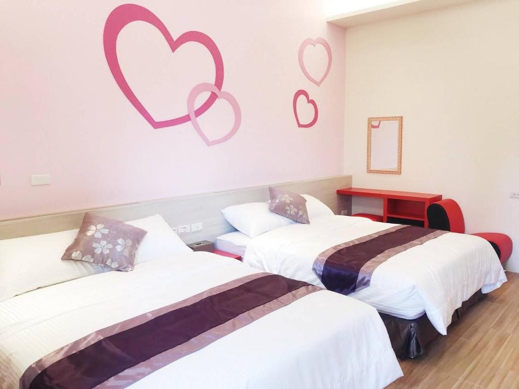 Postel nebo postele na pokoji v ubytování Purple Shell Homestay II
