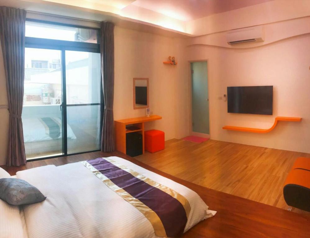 Postel nebo postele na pokoji v ubytování Purple Shell Homestay II