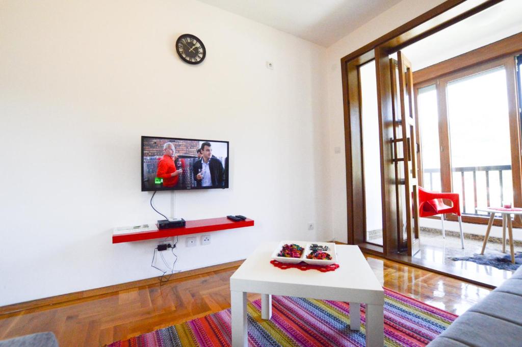 TV a/nebo společenská místnost v ubytování Apartment Holiday
