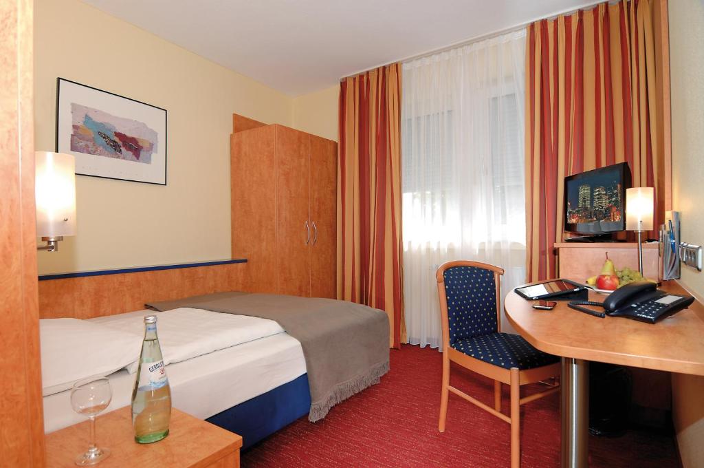 Postel nebo postele na pokoji v ubytování Hotel Ostmeier