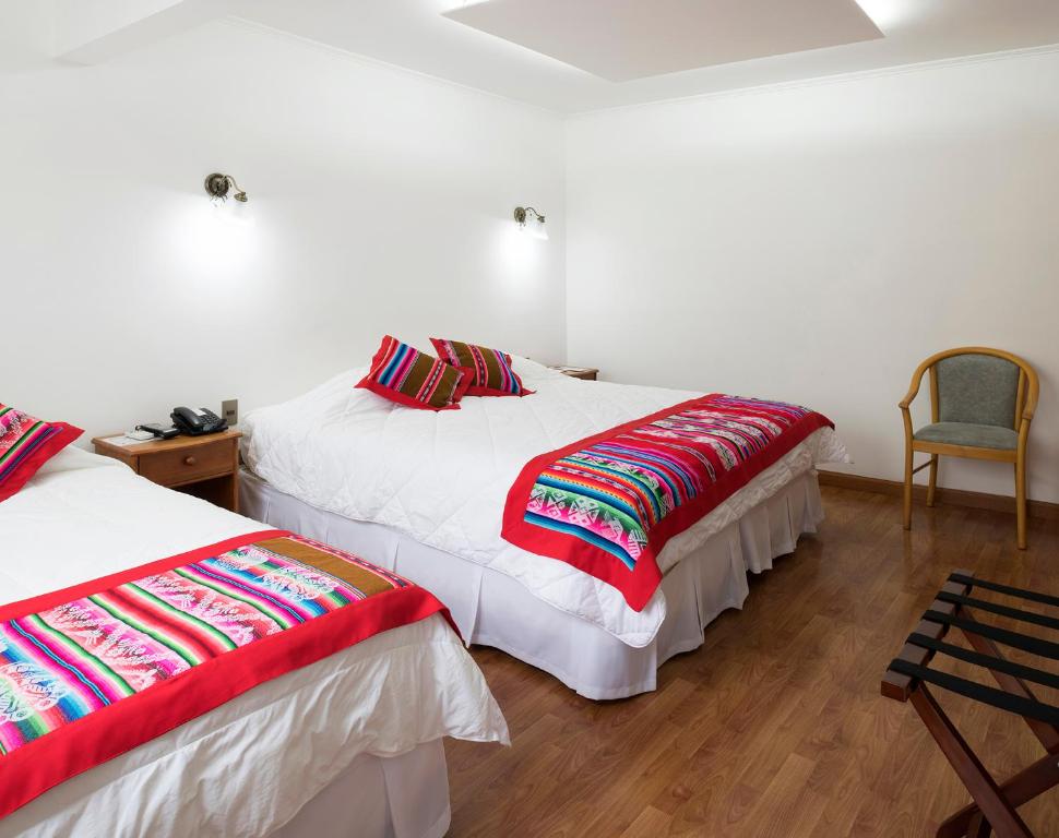 En eller flere senge i et værelse på Hotel Samaña