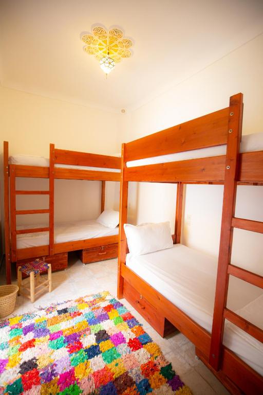 Postel nebo postele na pokoji v ubytování Mosaic Hostel