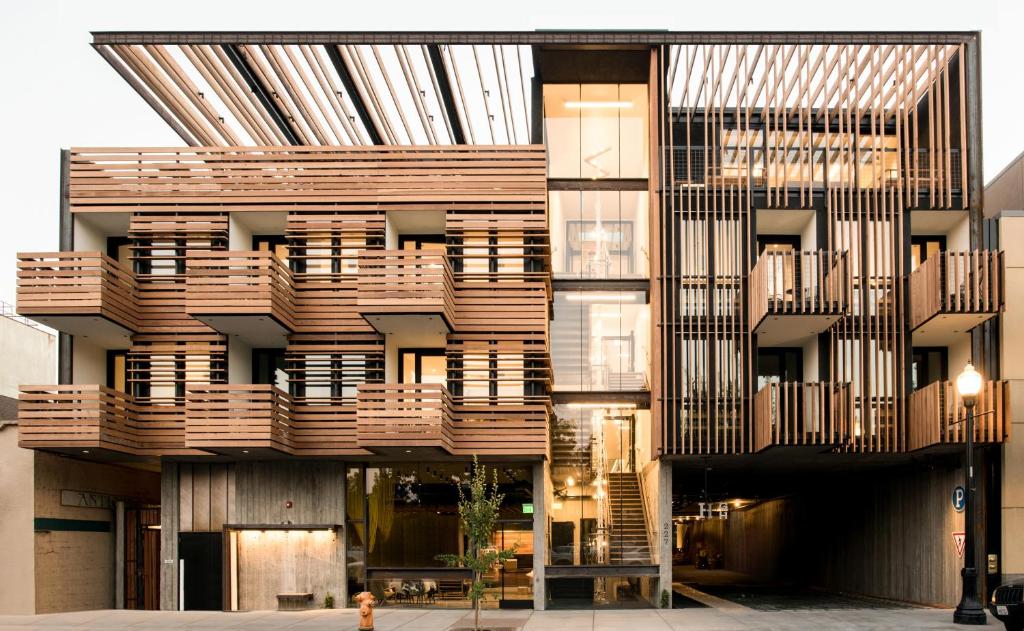 a building with wooden balconies on the side of it at Harmon Guest House in Healdsburg