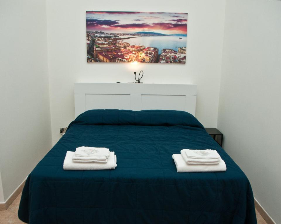 Un pat sau paturi într-o cameră la Casa del Palumbo