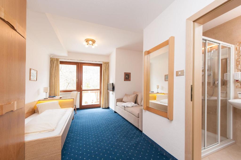 Postel nebo postele na pokoji v ubytování Hotel Lambrechtshof
