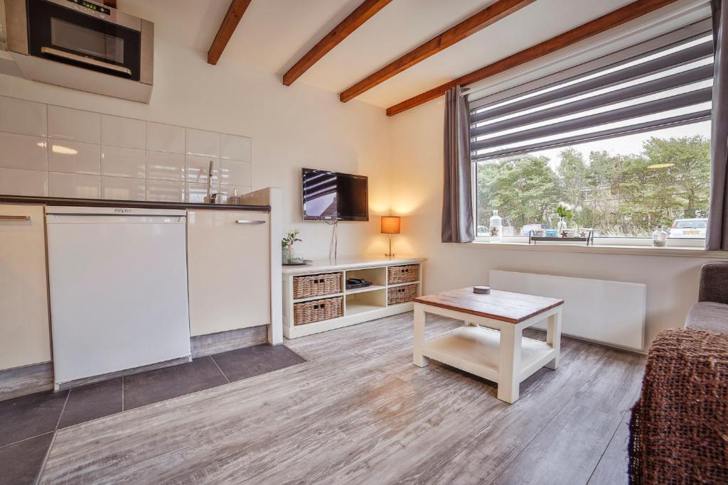 Η κουζίνα ή μικρή κουζίνα στο Het hoekhuisje