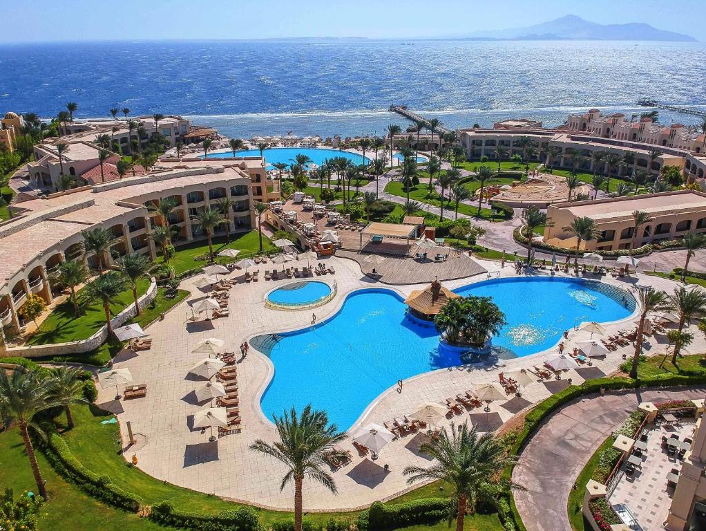 an aerial view of a resort with two pools at Cleopatra Luxury Resort Sharm El Sheikh in Sharm El Sheikh