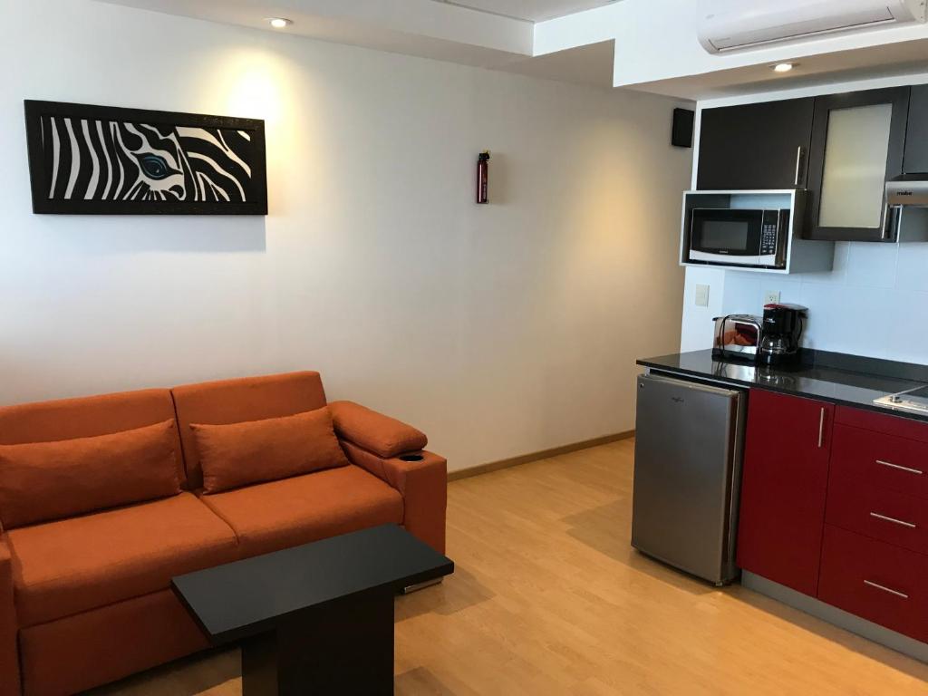 Kuchyň nebo kuchyňský kout v ubytování My Home Suites