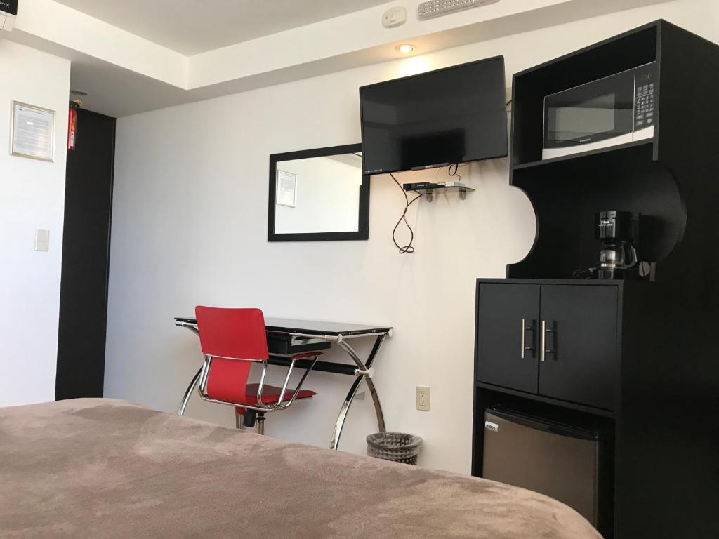 Kuchyň nebo kuchyňský kout v ubytování My Home Suites