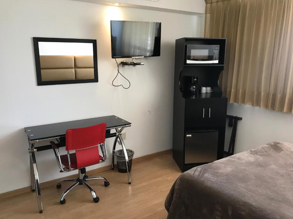 TV a/nebo společenská místnost v ubytování My Home Suites