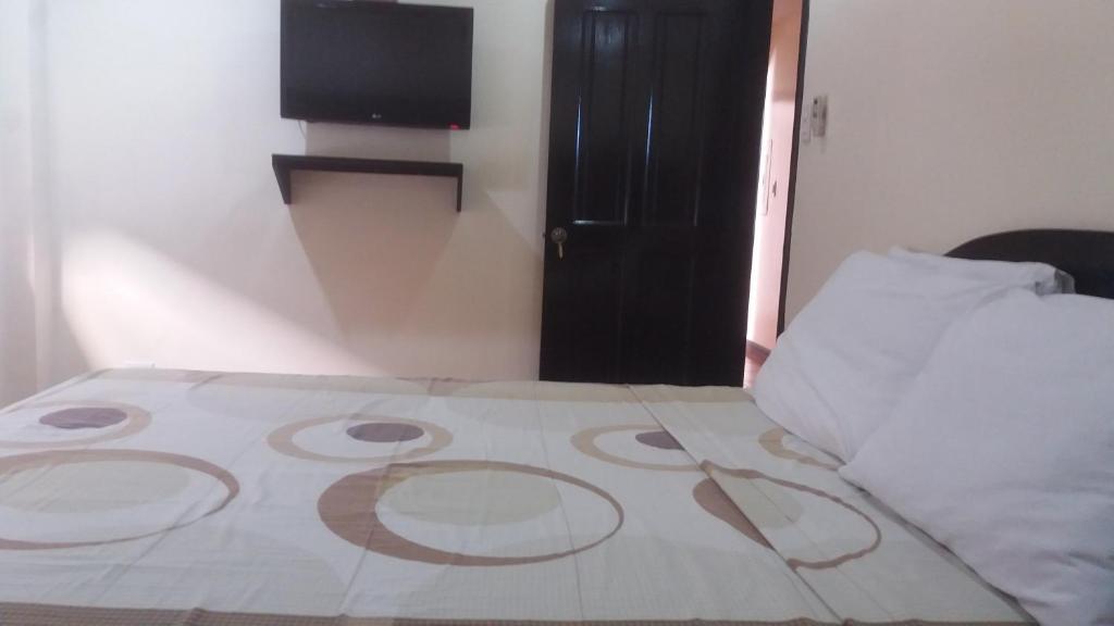 Postel nebo postele na pokoji v ubytování Boomerang Hotel