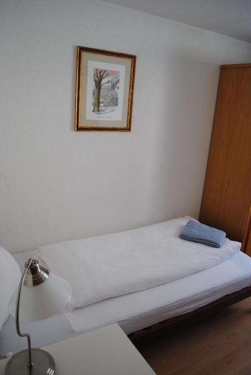 Postel nebo postele na pokoji v ubytování Hotel Weisses Kreuz
