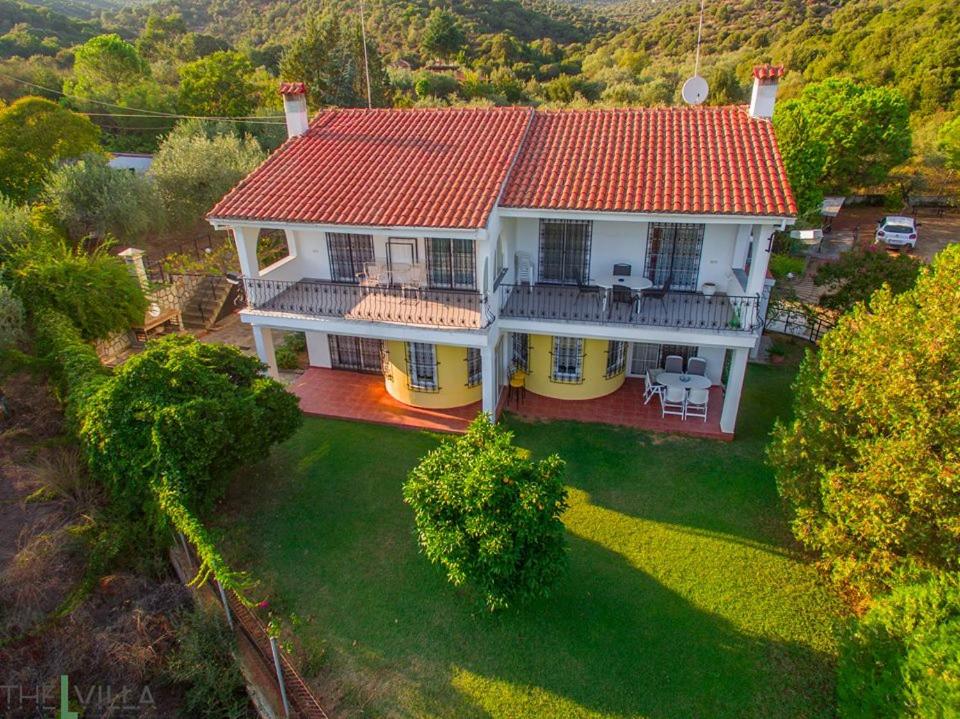 an overhead view of a house with a red roof at The L Villa in Nea Peramos