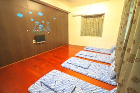 Postel nebo postele na pokoji v ubytování HaiAn Xian Homestay