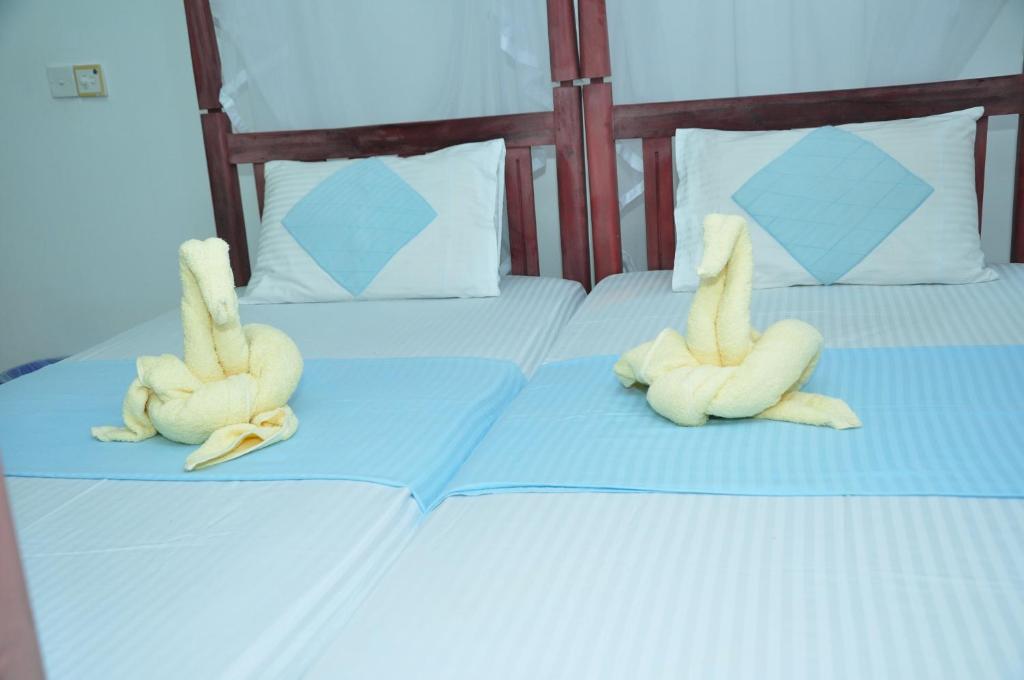 Postel nebo postele na pokoji v ubytování Latheena Resort