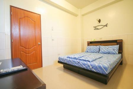 Postel nebo postele na pokoji v ubytování HaiAn Xian Homestay