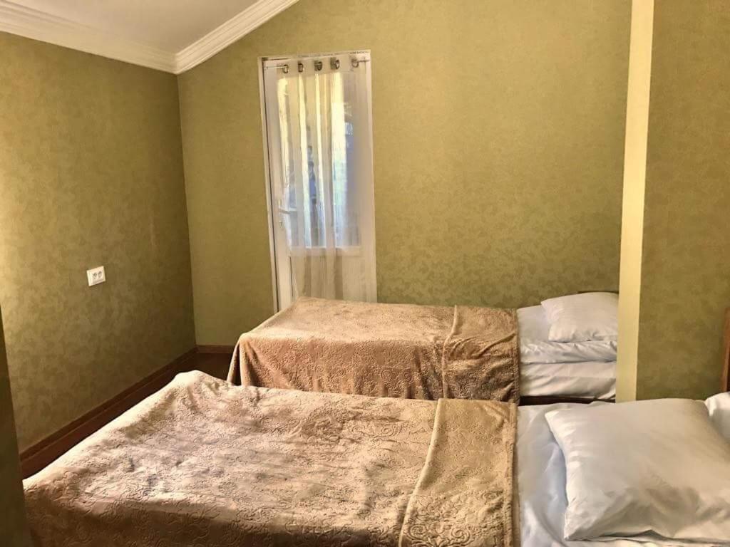Postel nebo postele na pokoji v ubytování Guesthouse Chela