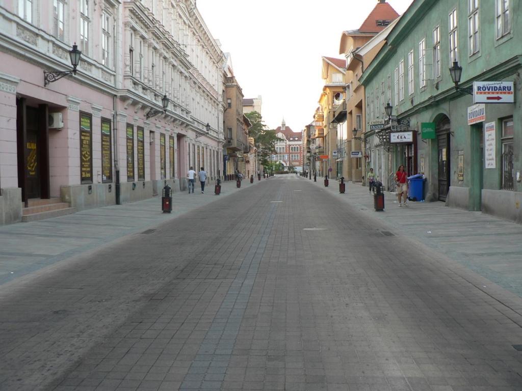 an empty street in the middle of a city at Kriston Apartman in Miskolc