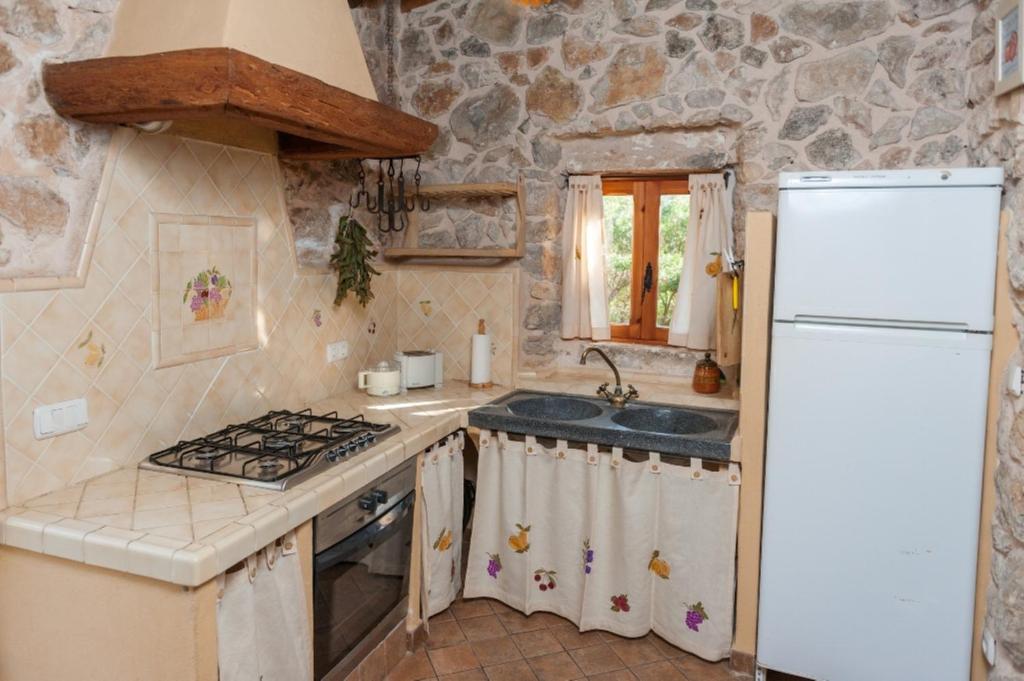 Kuchyň nebo kuchyňský kout v ubytování Casa De Piedra