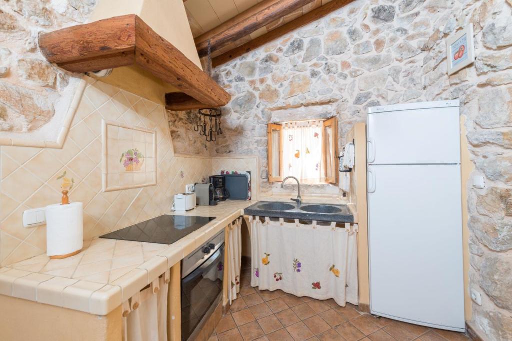 Kuchyň nebo kuchyňský kout v ubytování Casa De Piedra